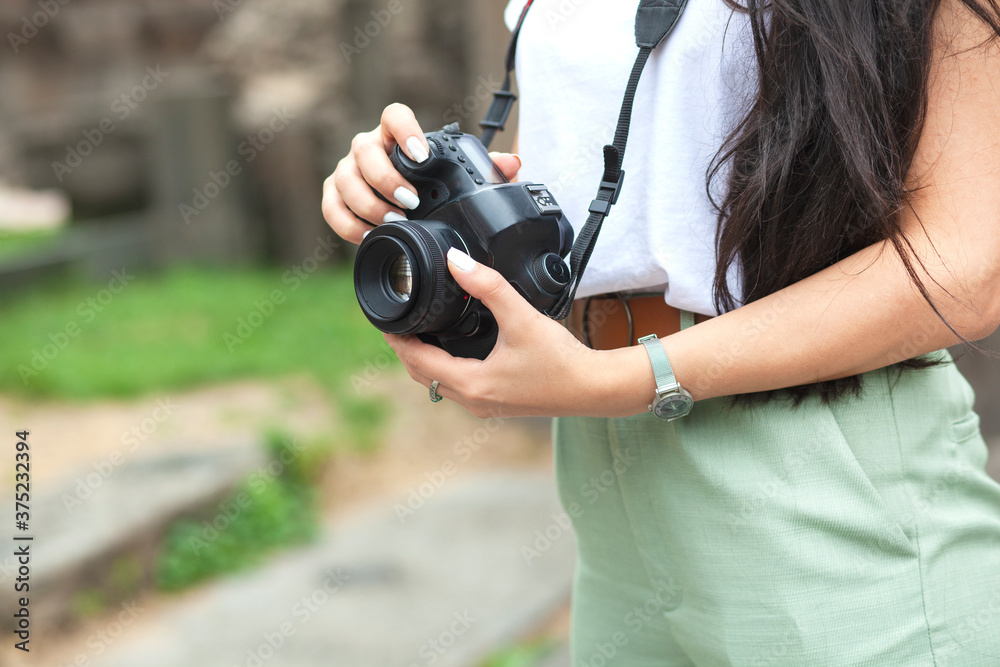 camera in the hand of a photographer camera in the hand of a photographer