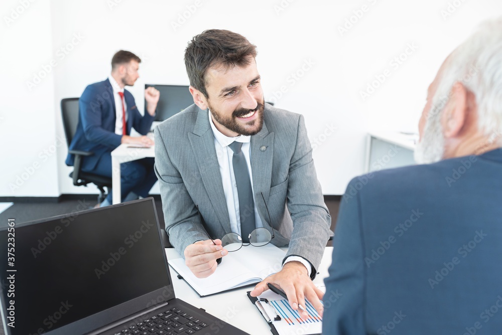 Business people discussing at office meeting Business people discussing at office meeting