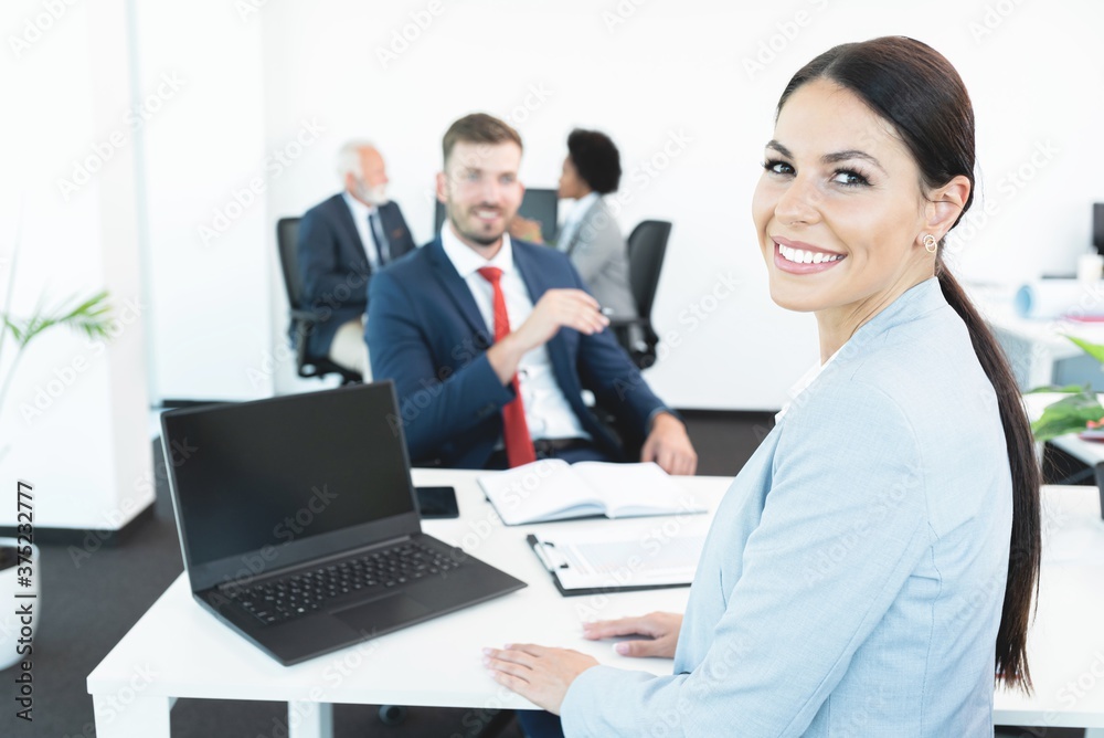Business colleagues discussing at office meeting Business colleagues discussing at office meeting