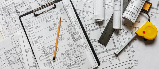 architect design working drawing sketch plans blueprints and making architectural construction model in architect studio,flat lay.