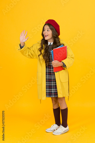 hello. cheerful child ready for schoolyear. education. happy childhood. notebooks for learning at class. back to school. retro girl wear uniform and parisian beret. kid school fashion © be free