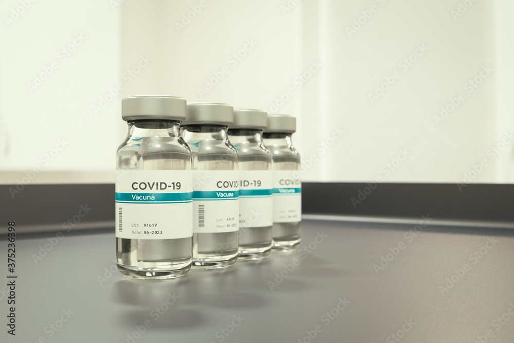 Medium shot of coronavirus vaccine bottle. Vaccine word in Spanish.