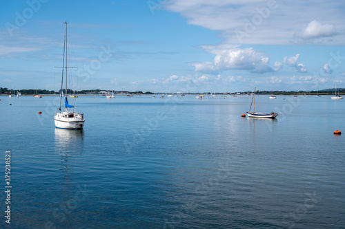 Yachts at anchor in the the popular location of Emsworth Harbour a calm and serene setting.