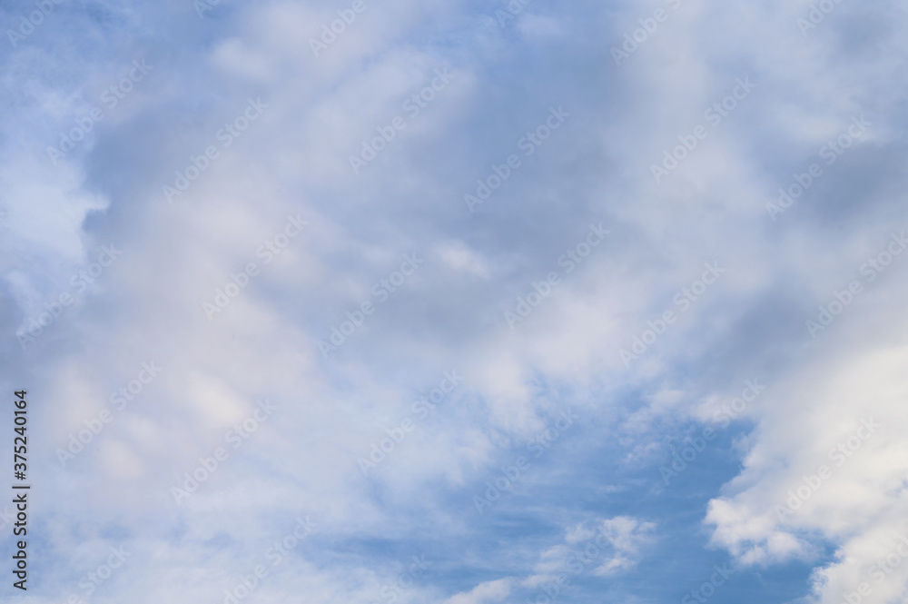 Abstract background of white fluffy clouds on a bright blue sky Abstract background of white fluffy clouds on a bright blue sky