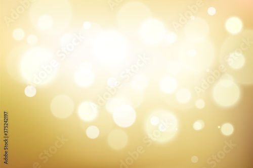 Gold glittering background with bokeh effect. Golden twinkled light backdrop for Wedding or Christmas decoration or xmas card 