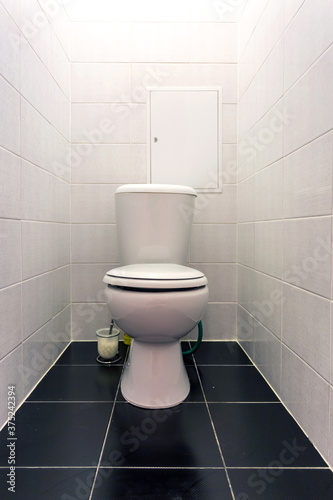 white ceramic toilet bowl in restroom