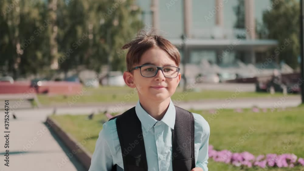 Online education, Back to school, Happy schoolboy, Learn lessons. Schoolboy with a backpack returns home from school Online education, Back to school, Happy schoolboy, Learn lessons. Schoolboy with a backpack returns home from school