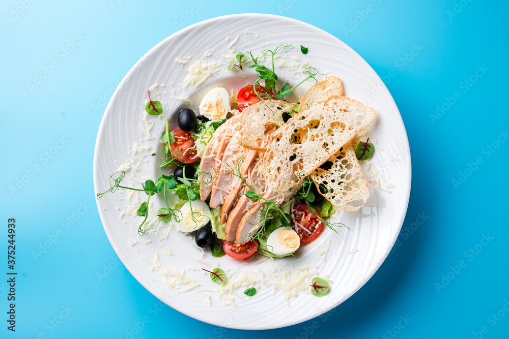 Caesar salad on a blue background Caesar salad on a blue background