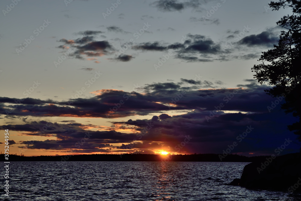 Last ray of the sun. Lake Keret, Northern Karelia, Russia