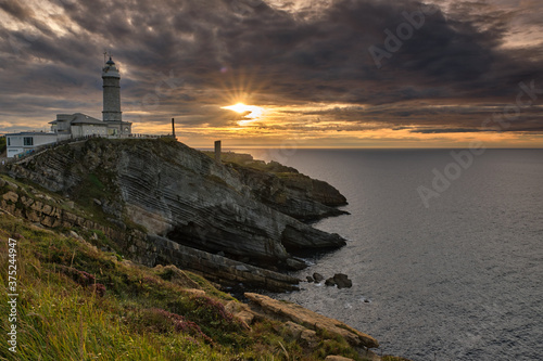 lighthouse at sunset © DAVID