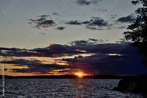 Last ray of the sun. Lake Keret, Northern Karelia, Russia photo