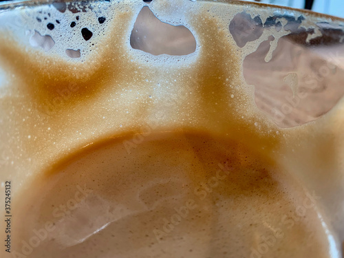 Stylish coffee foam in the glass