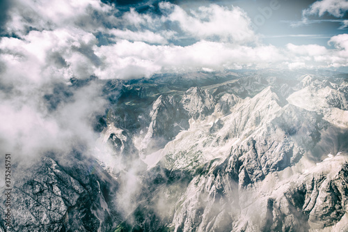 Mountain landscape from Marmolada mountain peak in italian alps against blue sky © jovannig