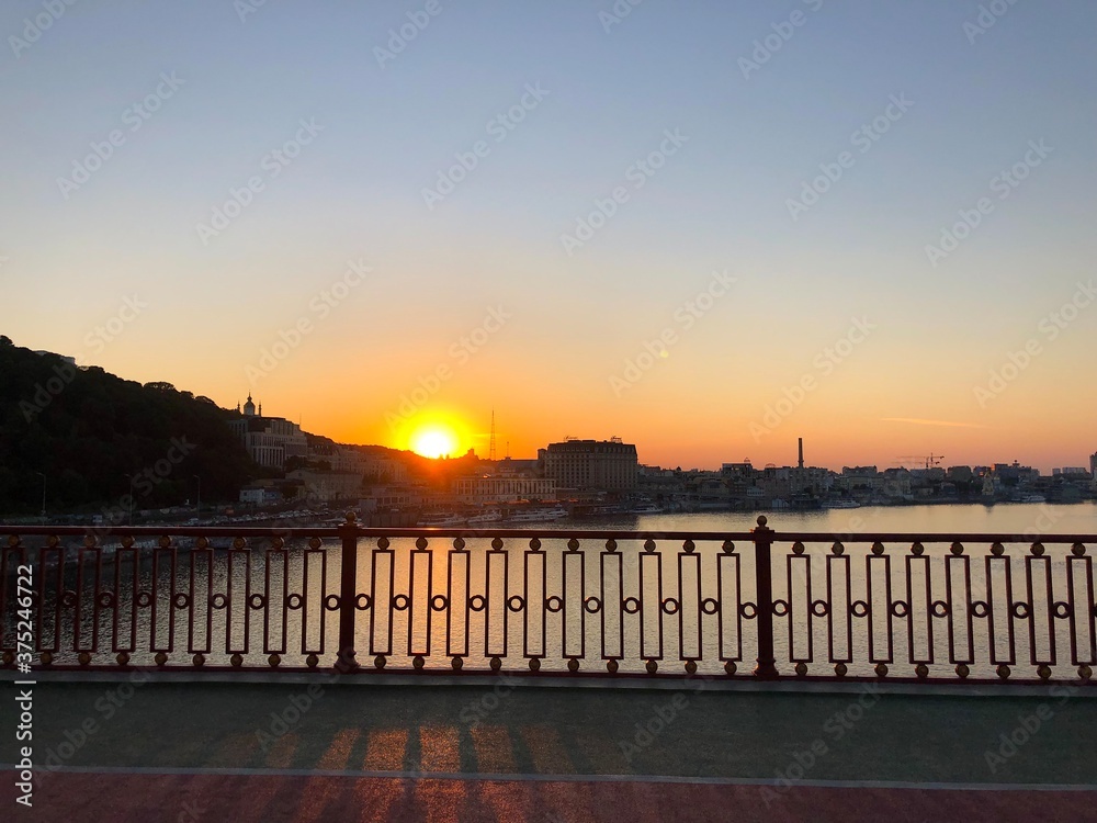 Sunset on pedestrian bridge in Kiev
