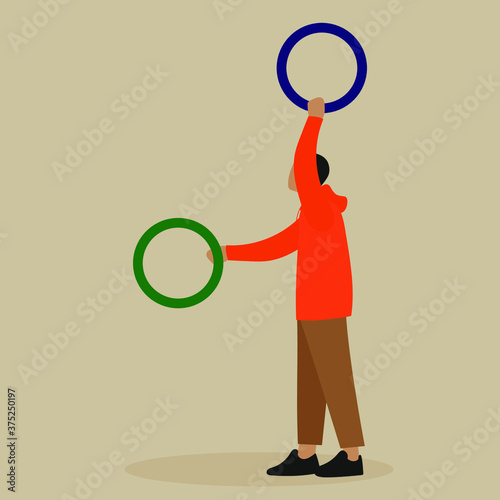 Man juggles with colored rings