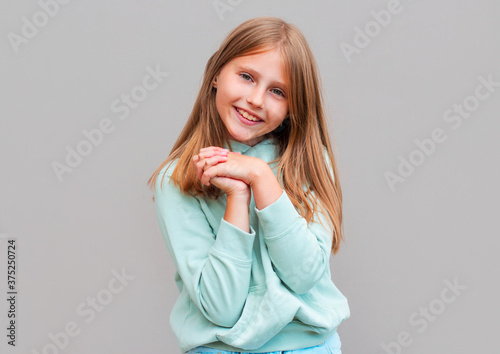 Close-up attractive, charming and feminine young laughing girl, clasp hands near chest, giggling and smiling broadly, gazing camera cheerful, showing positivity and optimistic emotions