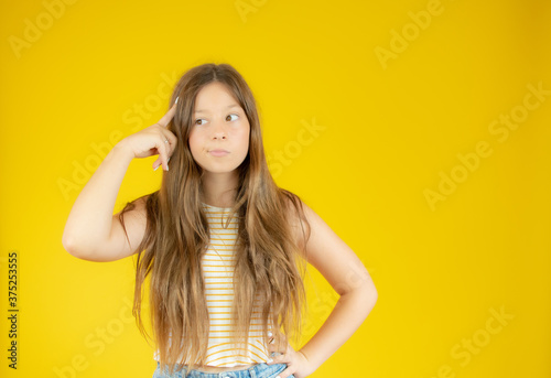 Beautiful girl with long hair with doubtful gesture