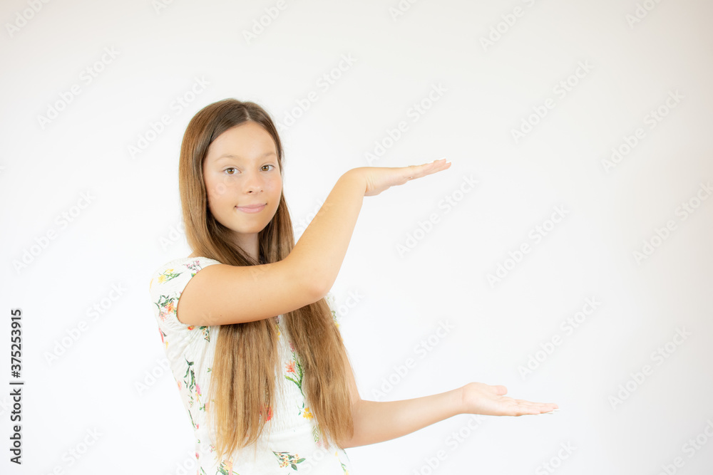 Smiling beautiful girl with long hair pointing something Smiling beautiful girl with long hair pointing something