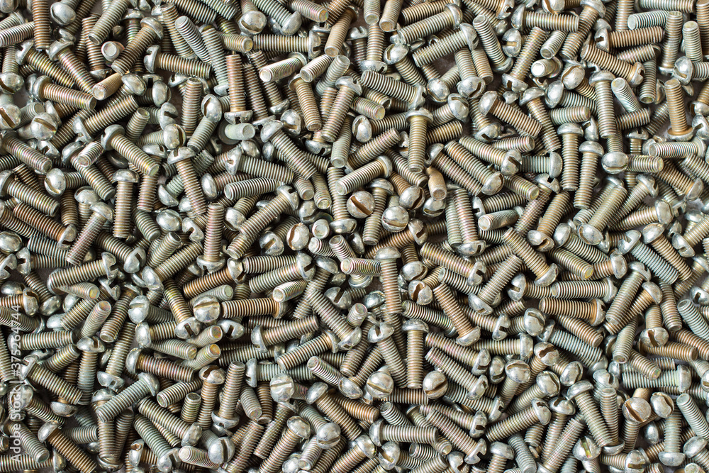 Stack of old metal bolts for background. Concept of construction and repair. Stack of old metal bolts for background. Concept of construction and repair.