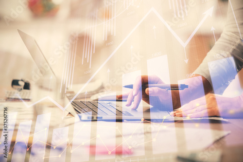 Double exposure of woman hands typing on computer and forex chart hologram drawing. Stock market invest concept.