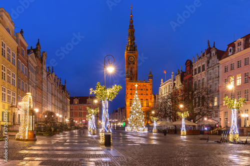 Christmas tree and illumination on Long Market Street and Town Hall at night in Old Town of Gdansk, Poland