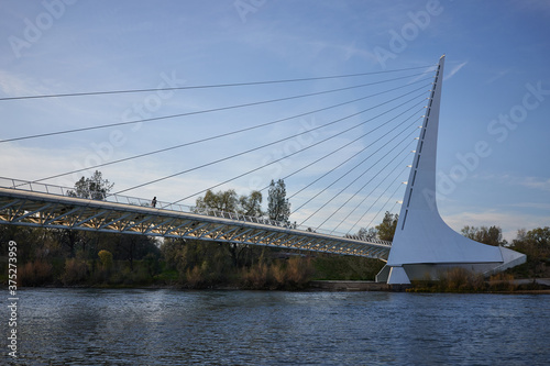 The Sundial Bridge, a cantilever spar cable-stayed and glass-decked bridge for bicycles and pedestrians that spans the Sacramento River in Redding, California, during sunset. photo