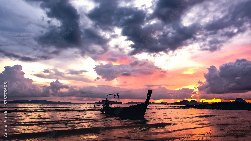 Beautiful sunset with fishing boat , Krabi Thailand