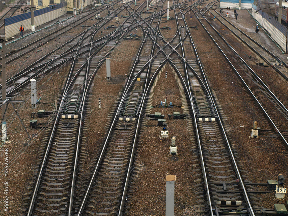 Empty railways in rainy cold autumn day. View from top, from an overpass. Suitable for using metaphorically for making choice or saying goodbye and other design ideas Empty railways in rainy cold autumn day. View from top, from an overpass. Suitable for using metaphorically for making choice or saying goodbye and other design ideas