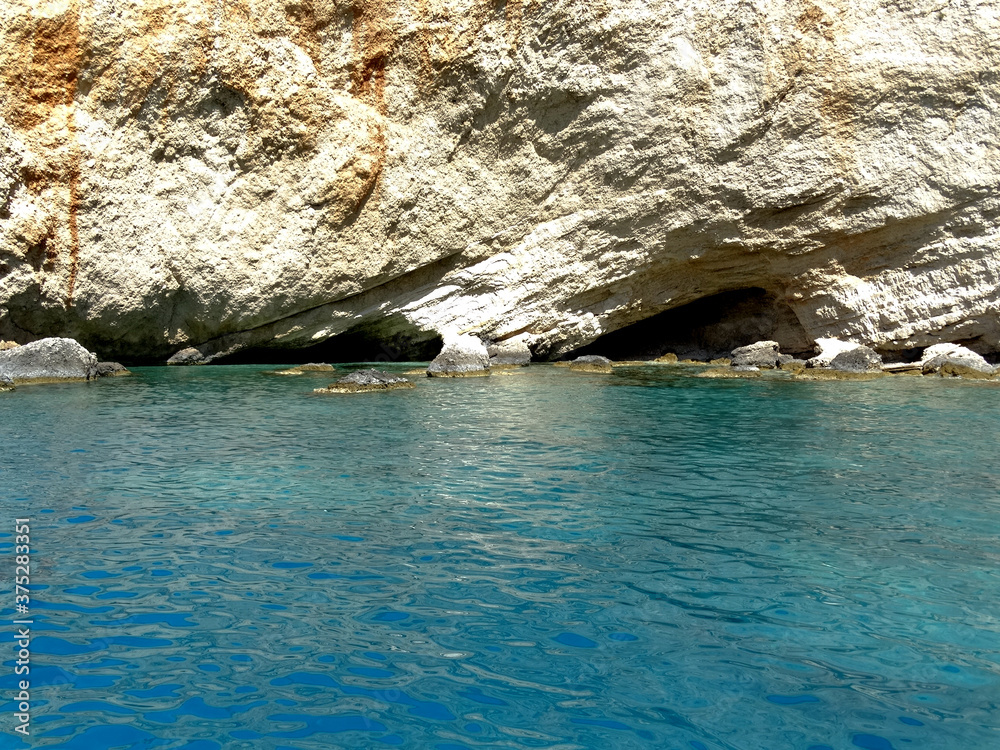 Sea cave at Porto Katsiki beach in Ionian sea in western Greece. Tourists visit western Greek island for its natural mountainous and Ionian seascape.