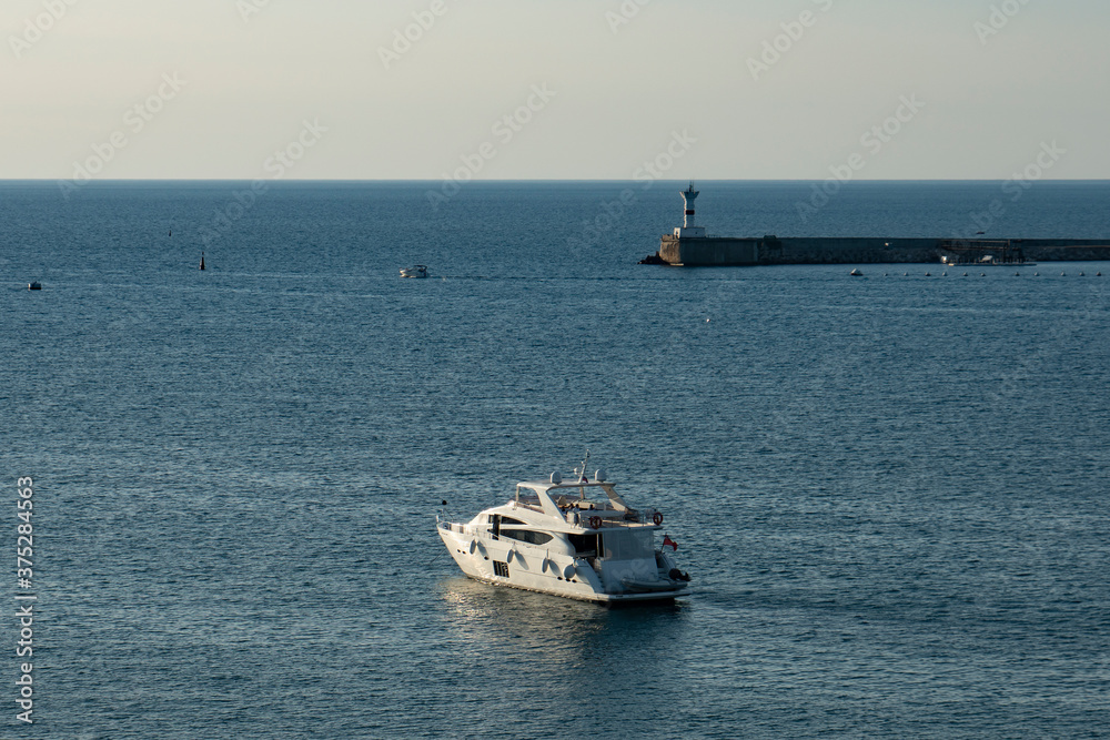 Motor yacht in the sea bay.