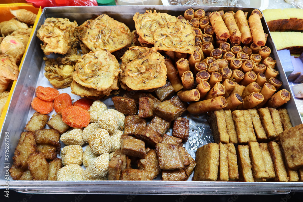 Georgetown, Penang, Malaysia, January 4, 2020: Prepared food at Pasar Lebuh Cecil Market in Georgetown, Malaysia.