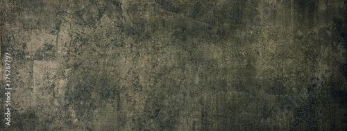 暗い色の古びた質感のある壁の背景テクスチャー