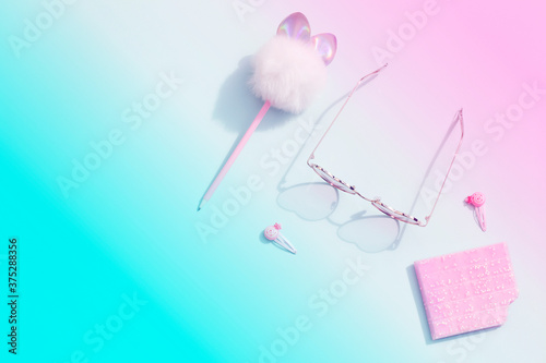 pink school stationery on pink and blue bright background.Back to school minimal concept.