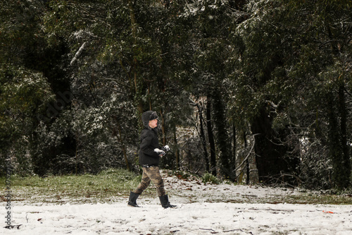 Boy playing in the snow at Yetholme, New South Wales, Australian winter 2020
