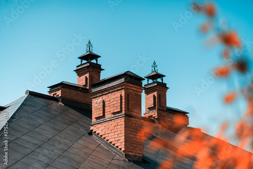 The house is of red brick with a copper roof photo