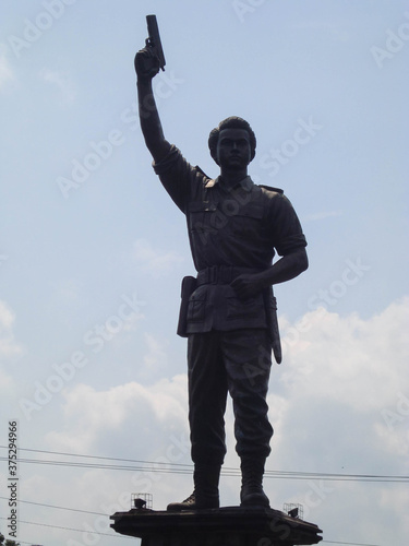 A hero statue on the main street of town