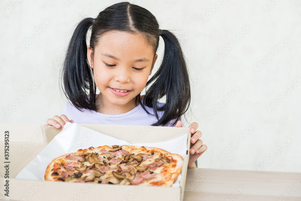 girl recommend eat this delicious pizza!, happy hard working food distributor holds opened box with appetizing pizza, delivers in time, courier delivers appetizing fast food in cardboard container. girl recommend eat this delicious pizza!, happy hard working food distributor holds opened box with appetizing pizza, delivers in time, courier delivers appetizing fast food in cardboard container.