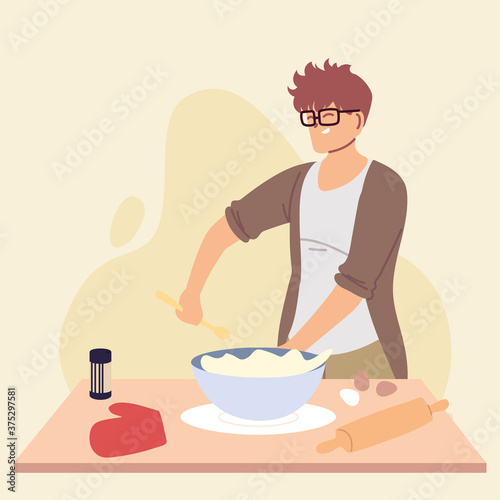 young man cook preparing a cake