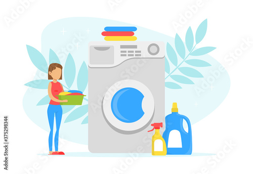 Tiny Young Woman Loading Big Washing Machine in Laundry Room, Laundry Process with Clean Clothes and Detergent Bottles Flat Vector Illustration