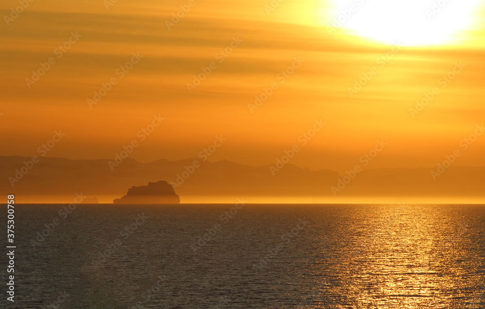 Stunning winter views of the arctic with icebergs and reflections on the sea and ocean.	