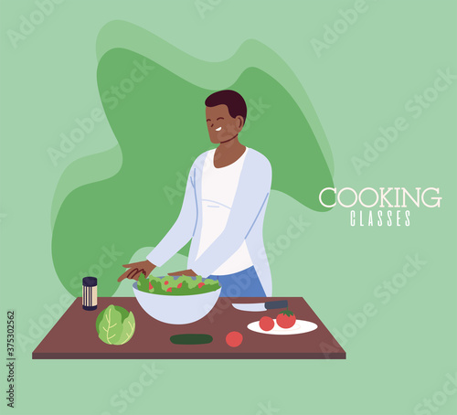 young man cook preparing healthy food in cooking classes