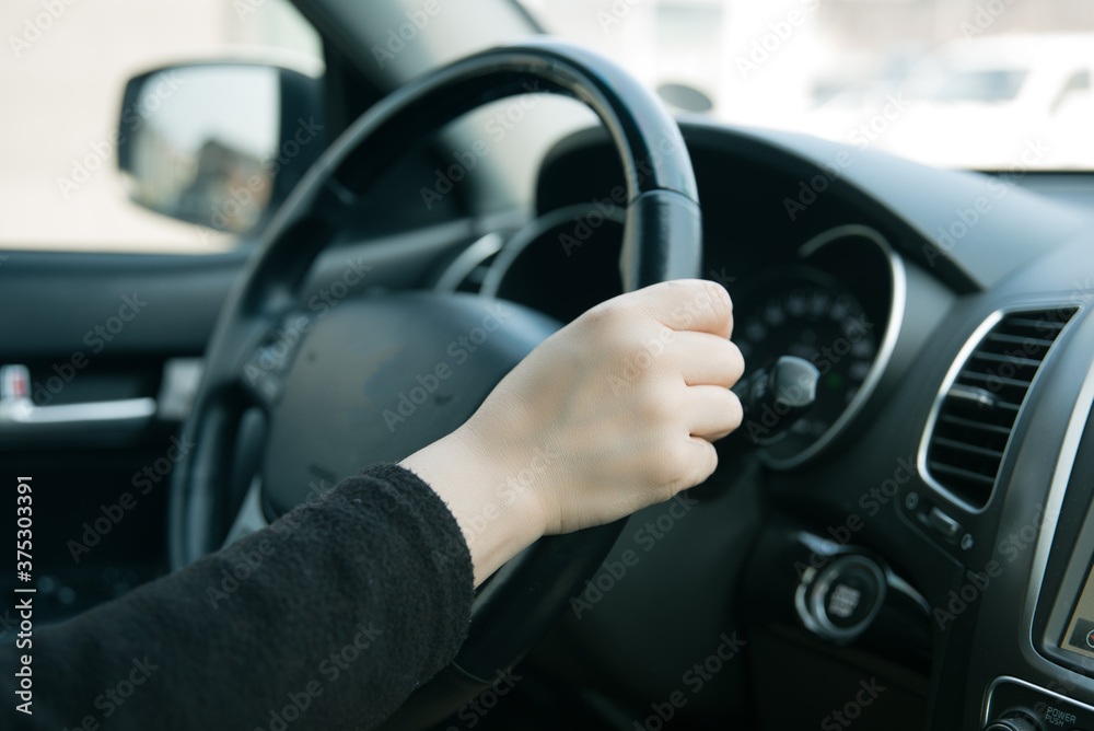 driving woman's hand