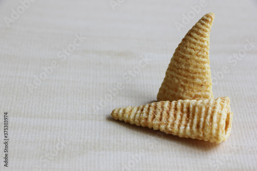 Cone of Corns Snack. Yellow, puffed.
