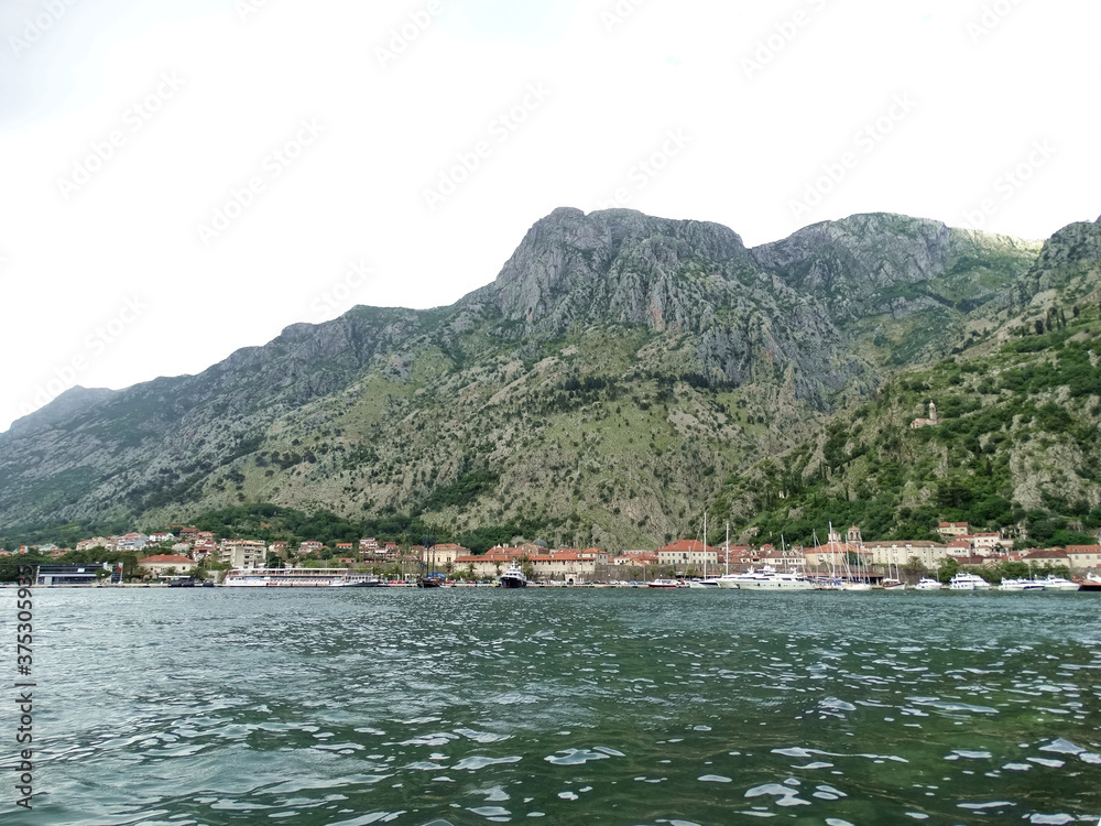 Panoramic view of Kotor bay in Kotor, Montenegro. Kotor is a coastal town in a secluded Gulf of Kotor, its preserved medieval old town is an UNESCO World Heritage Site. 