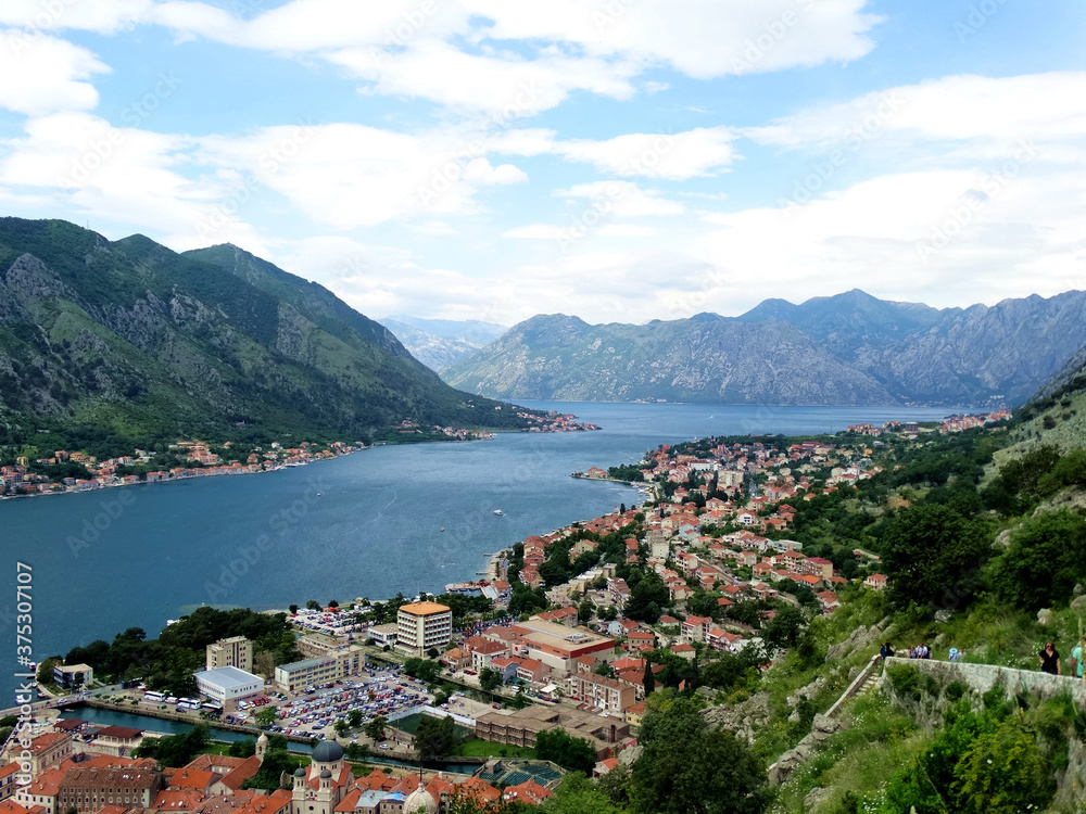 Aerial view of Kotor bay and old city in Kotor, Montenegro. Kotor is a coastal town in a secluded Gulf of Kotor, its preserved medieval old town is an UNESCO World Heritage Site. 