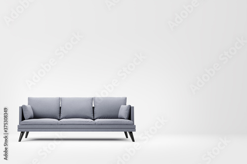 Grey couch with pillows on studio white background. photo