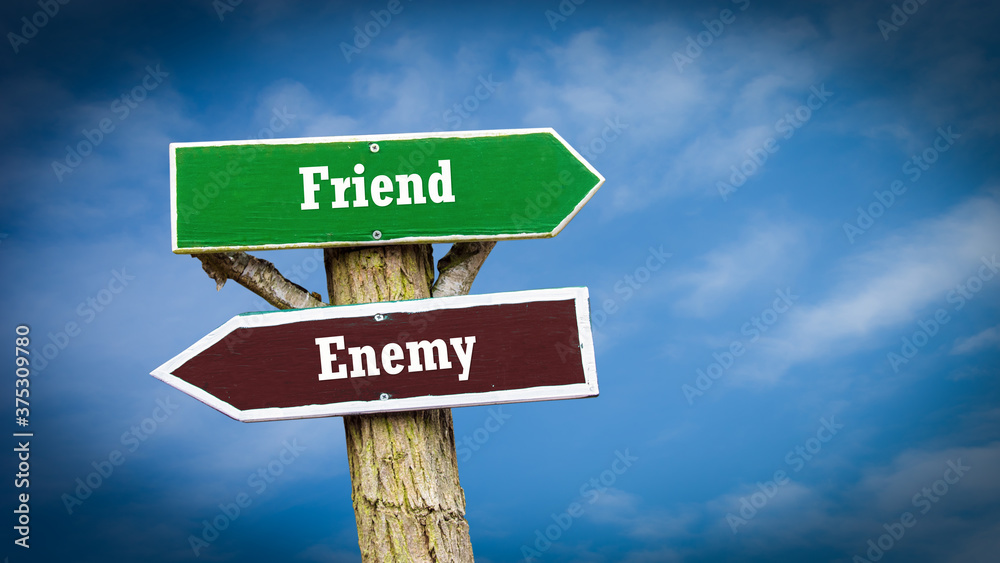 Fototapeta premium Street Sign to Friend versus Enemy