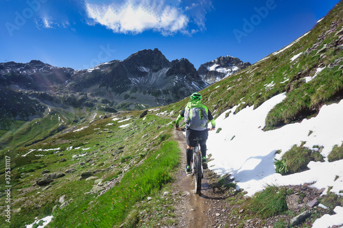 Mountain biking in a small narrow mountain path
