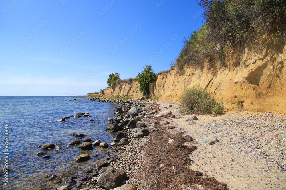 The shore along the steep coast of the holiday destination 