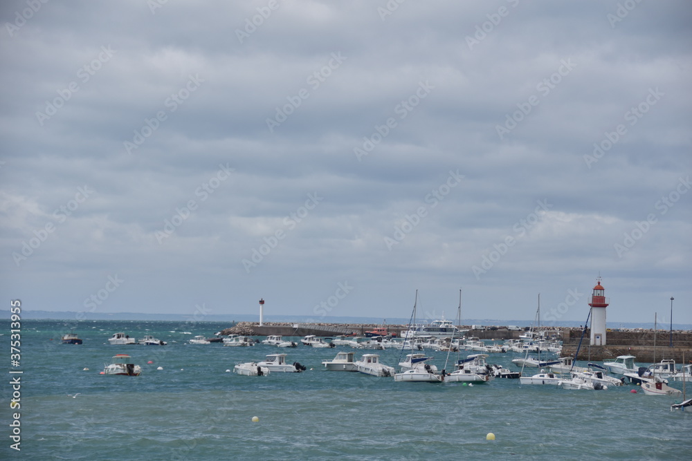 Harbour in the Bretagne with boats and the sea visible. 